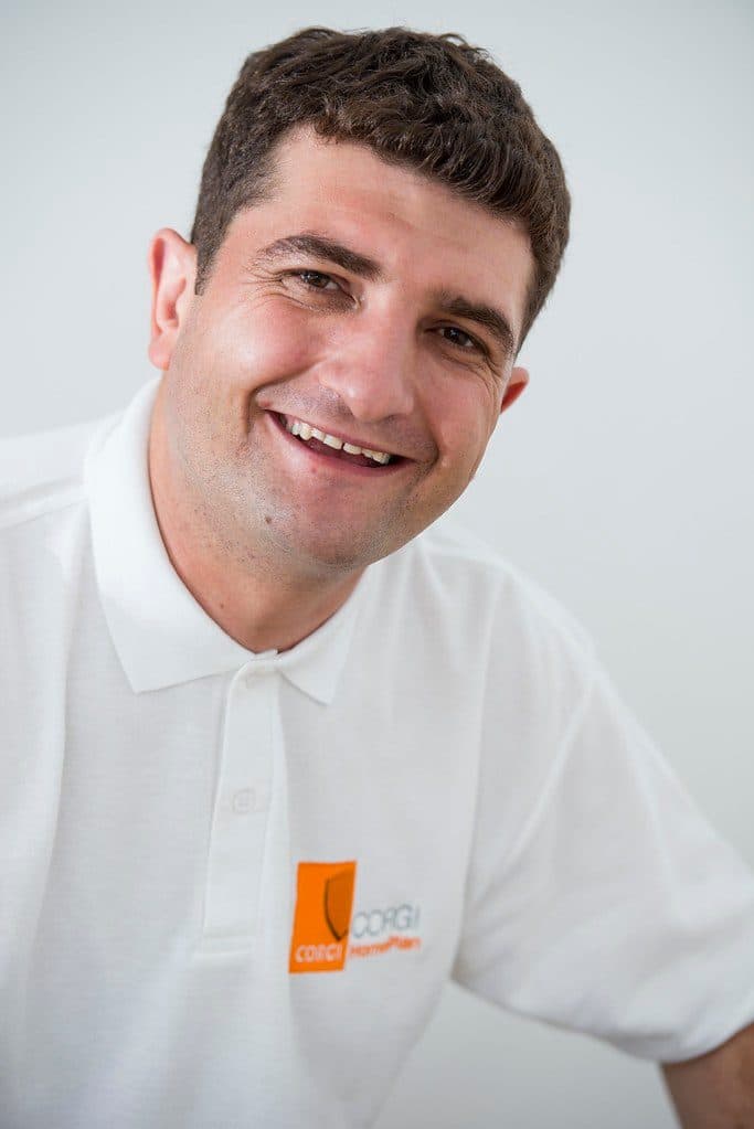 Gas Safe heating engineer diagnosing a boiler fault in a UK home