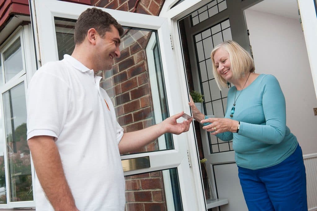 Gas Safe registered heating engineer working on a boiler in a UK home